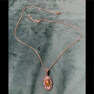 Gold necklace with brown stone